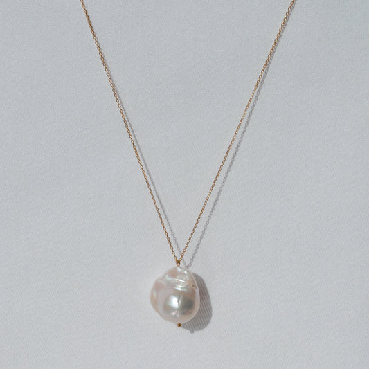 delicate gold pendant necklace with big natural baroque pearl