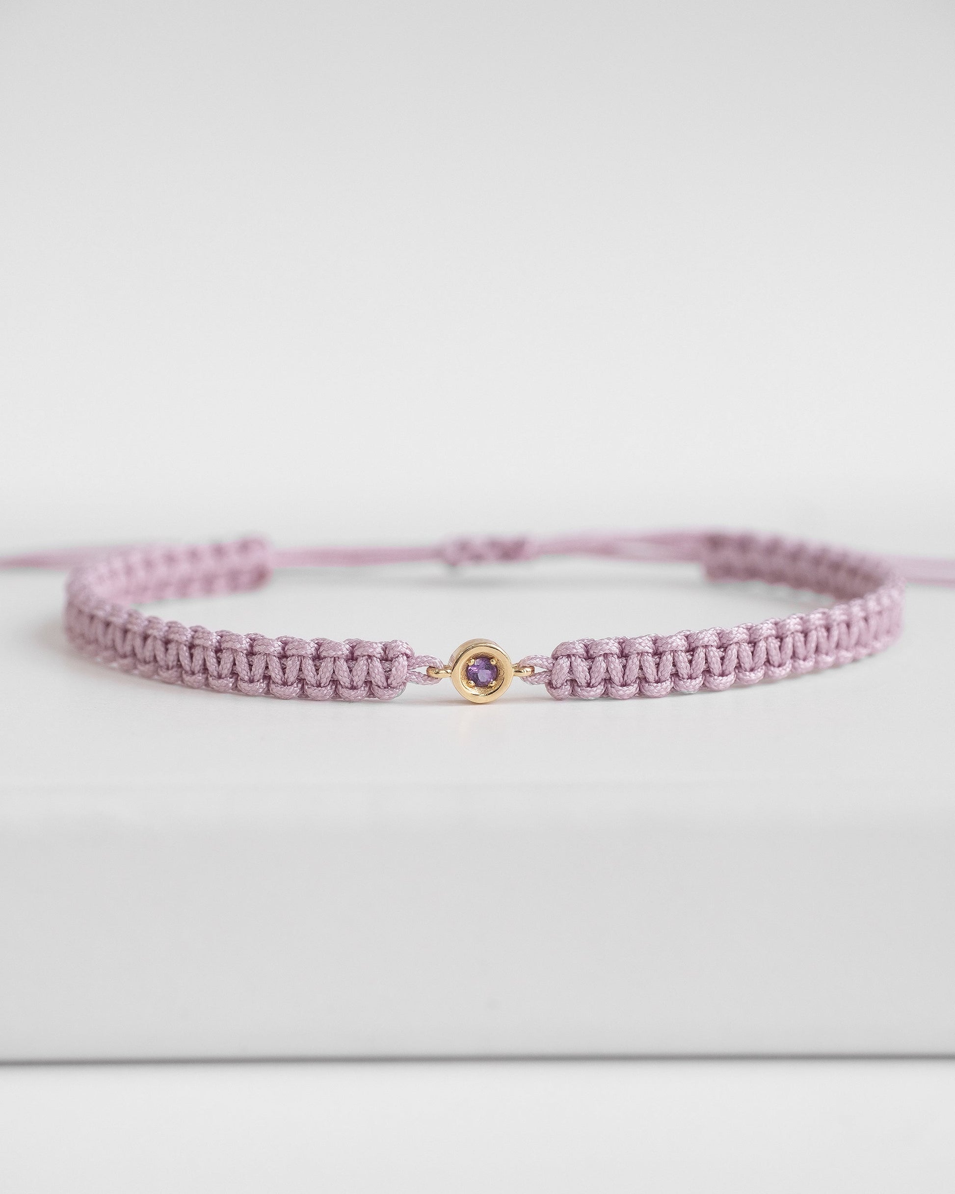 Purple cord bracelet with gold clasp and amethyst 