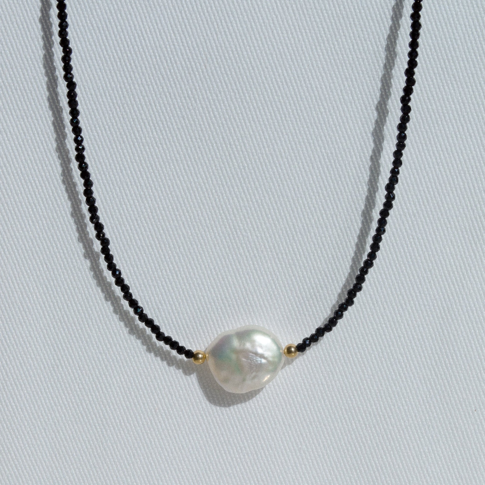 gold necklace with black spinel beads, baroque pearl and tiny gold balls 