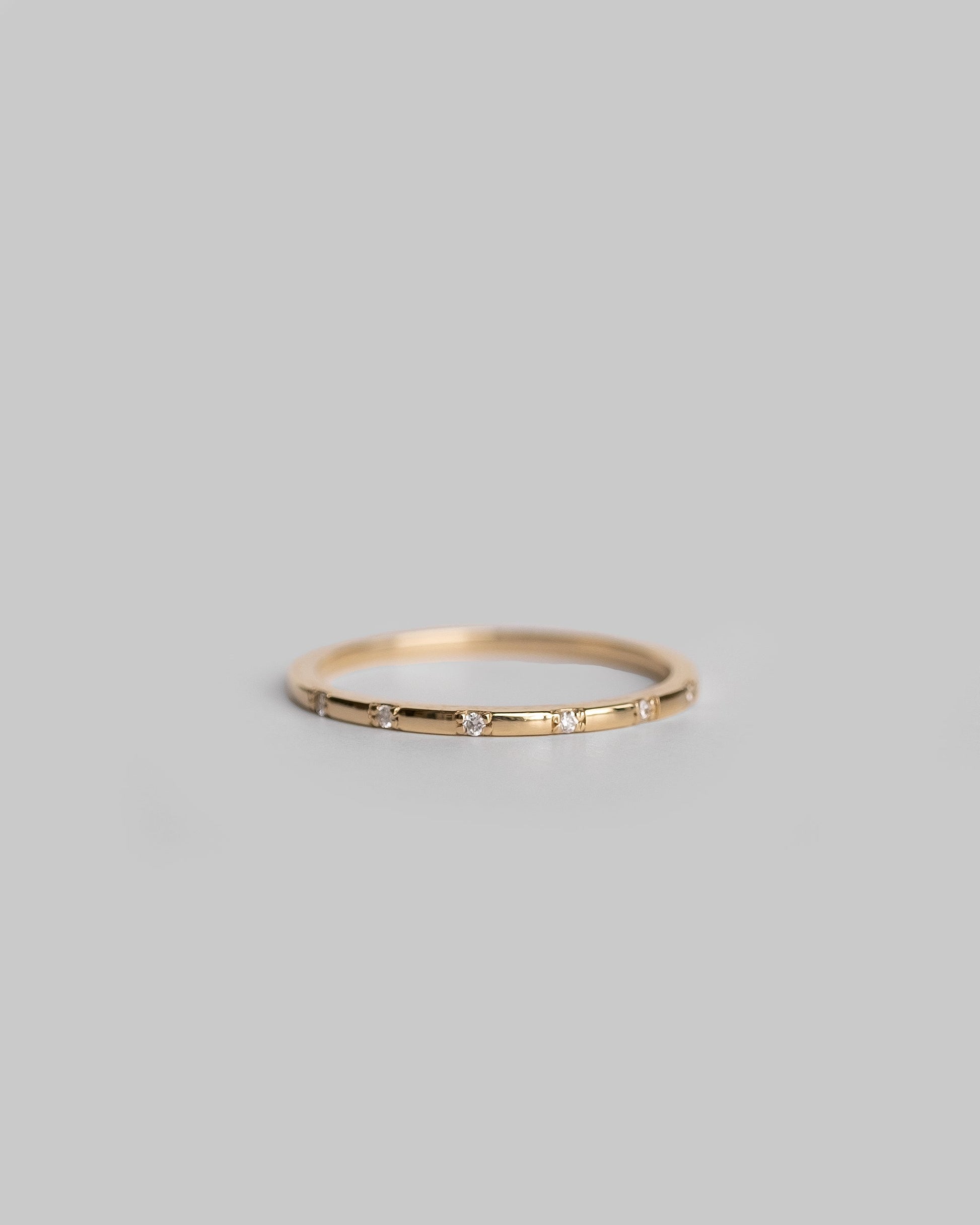 delicate gold ring with tiny diamonds 