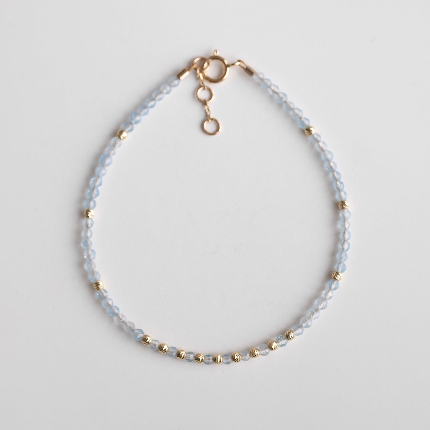gold bracelet with  aquamarine stones 
