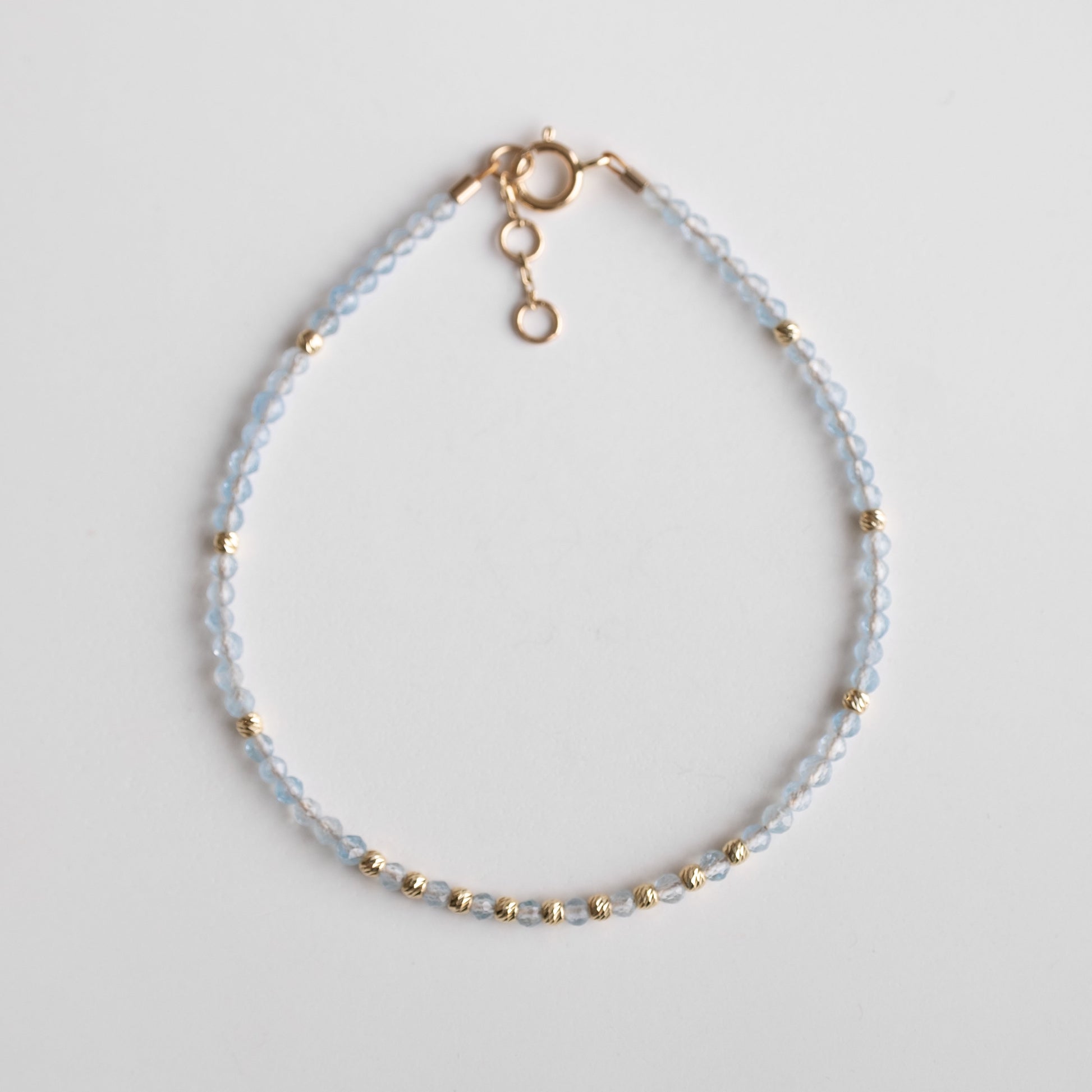 gold bracelet with  aquamarine stones 