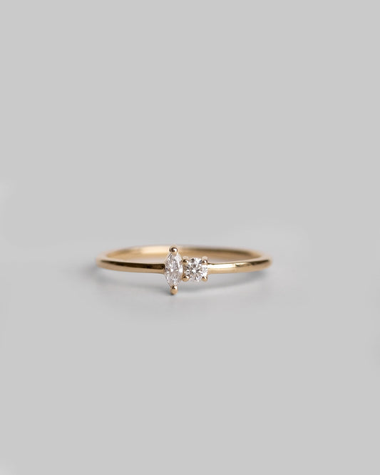 delicate gold ring with marquise and round diamond