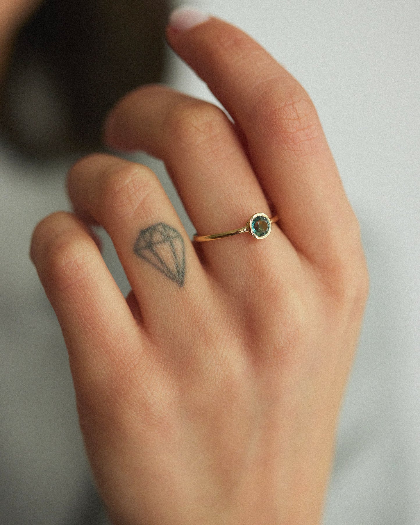 Bezel Set Teal Sapphire Ring