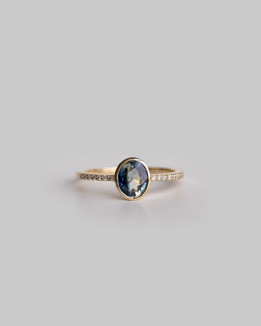 bi color sapphire ring with delicate diamond pave band