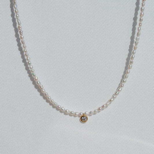 pearl beaded necklace with single large diamond 