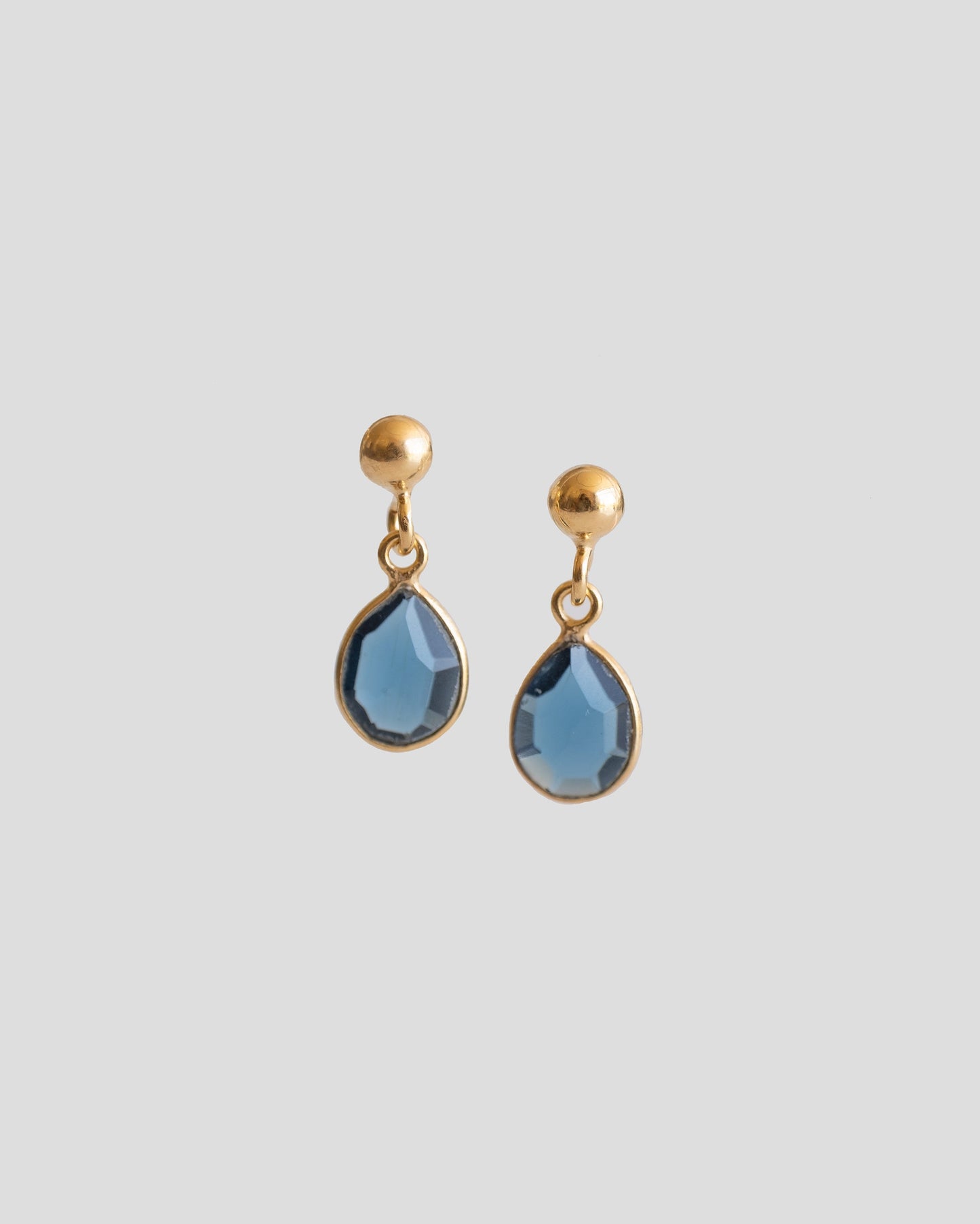 drop earrings with royal blue gemstone and gold plated ball 