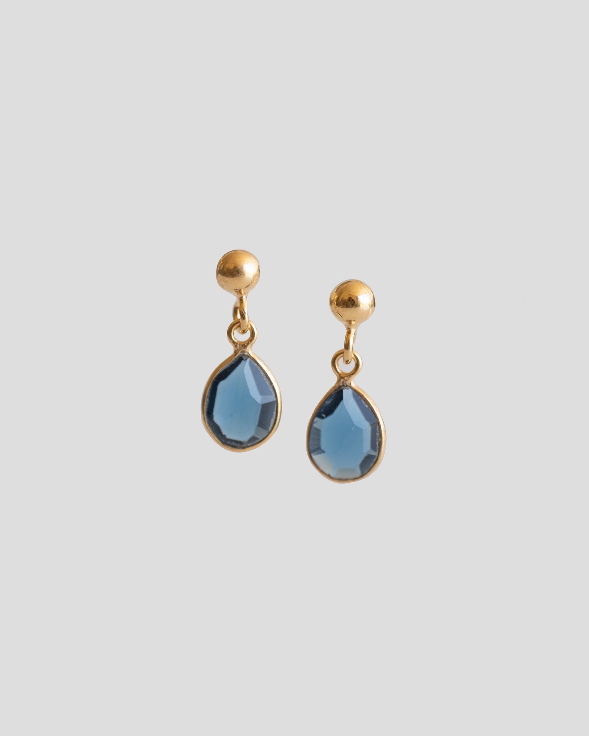 drop earrings with royal blue gemstone and gold plated ball 
