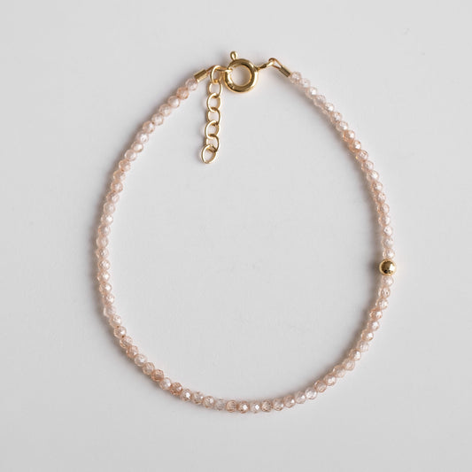 delicate gold vermeil bracelet with zirconia beads and single gold plated bead 